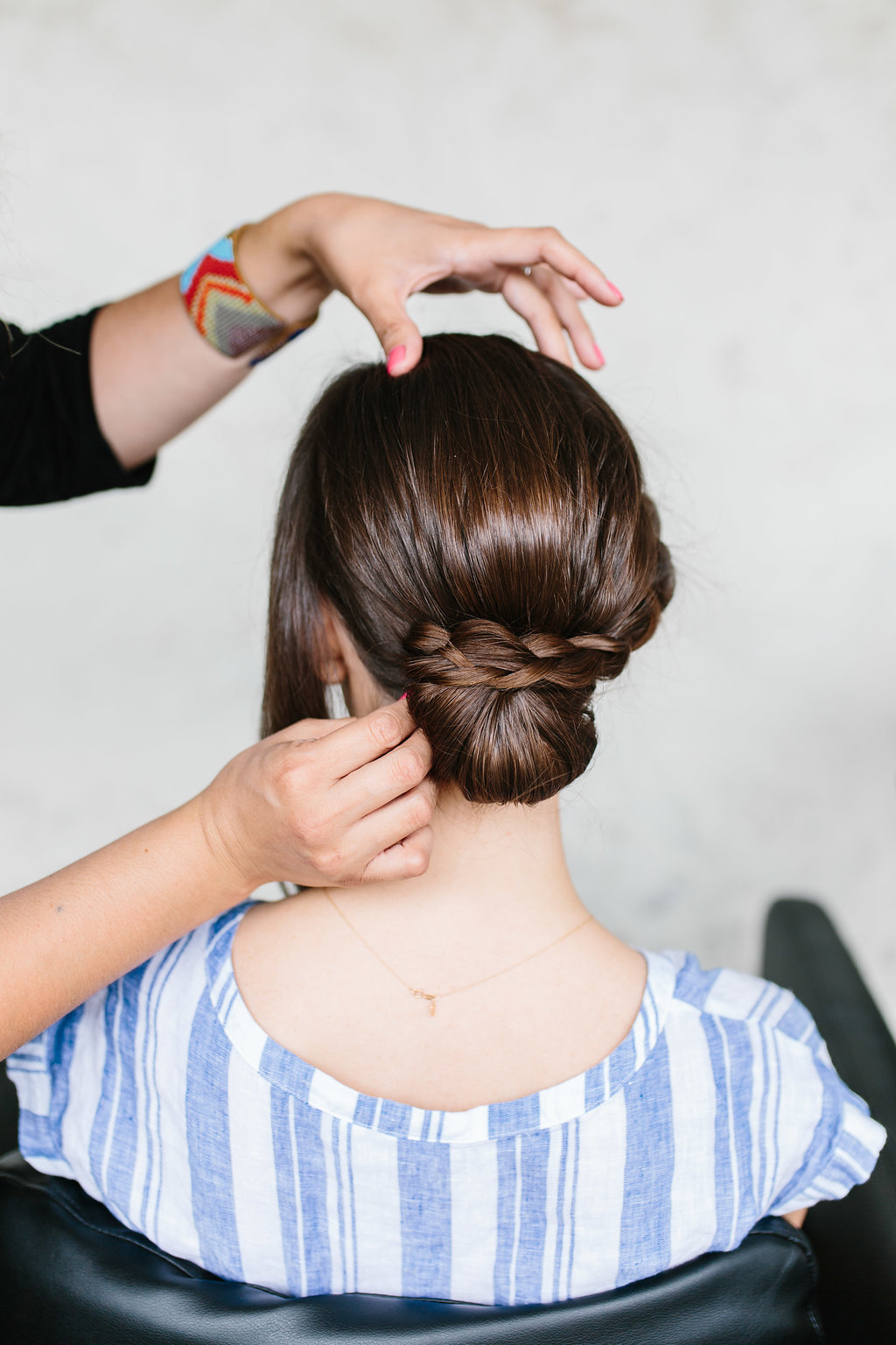 Securing a braid to the bun