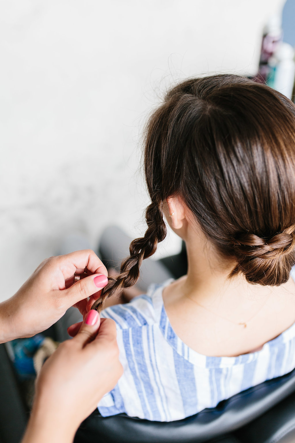 Braiding another section of the hair