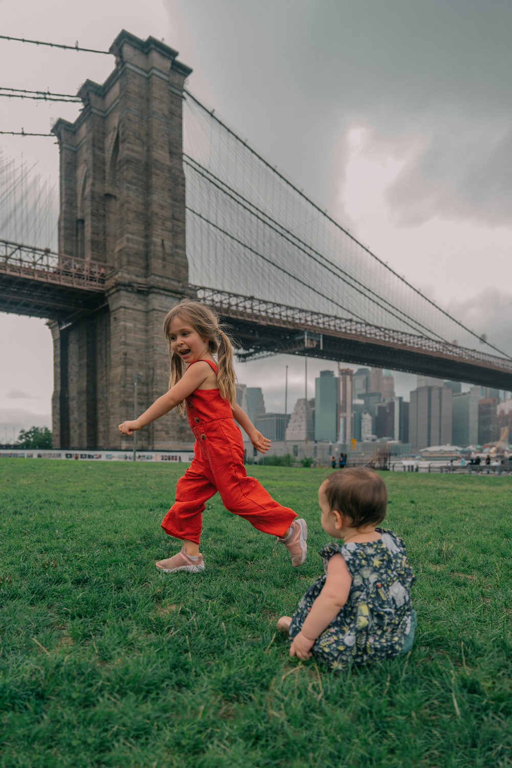 Kids playing near brooklyn bridge