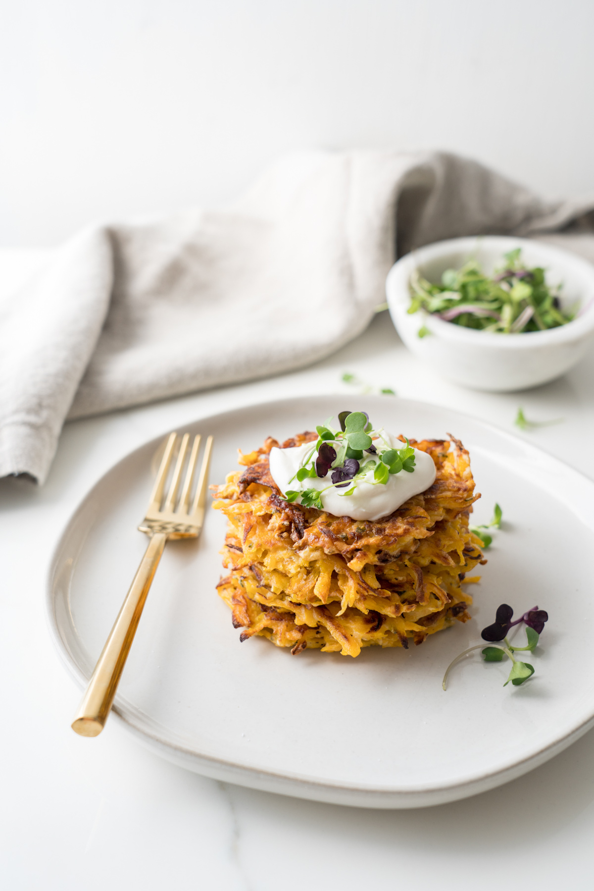 butternut squash fritters served on a white plate