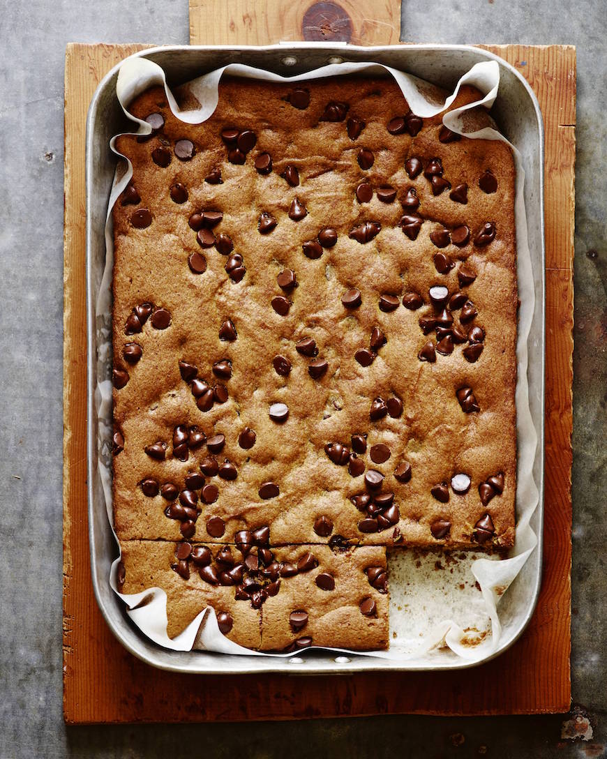 A cake in a cake pan with chocolate chips