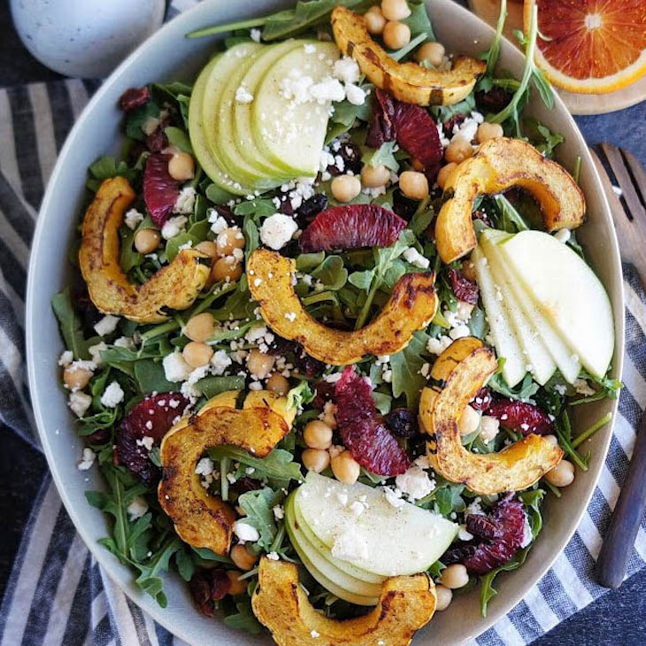 A fall salad recipe served in a large white bowl