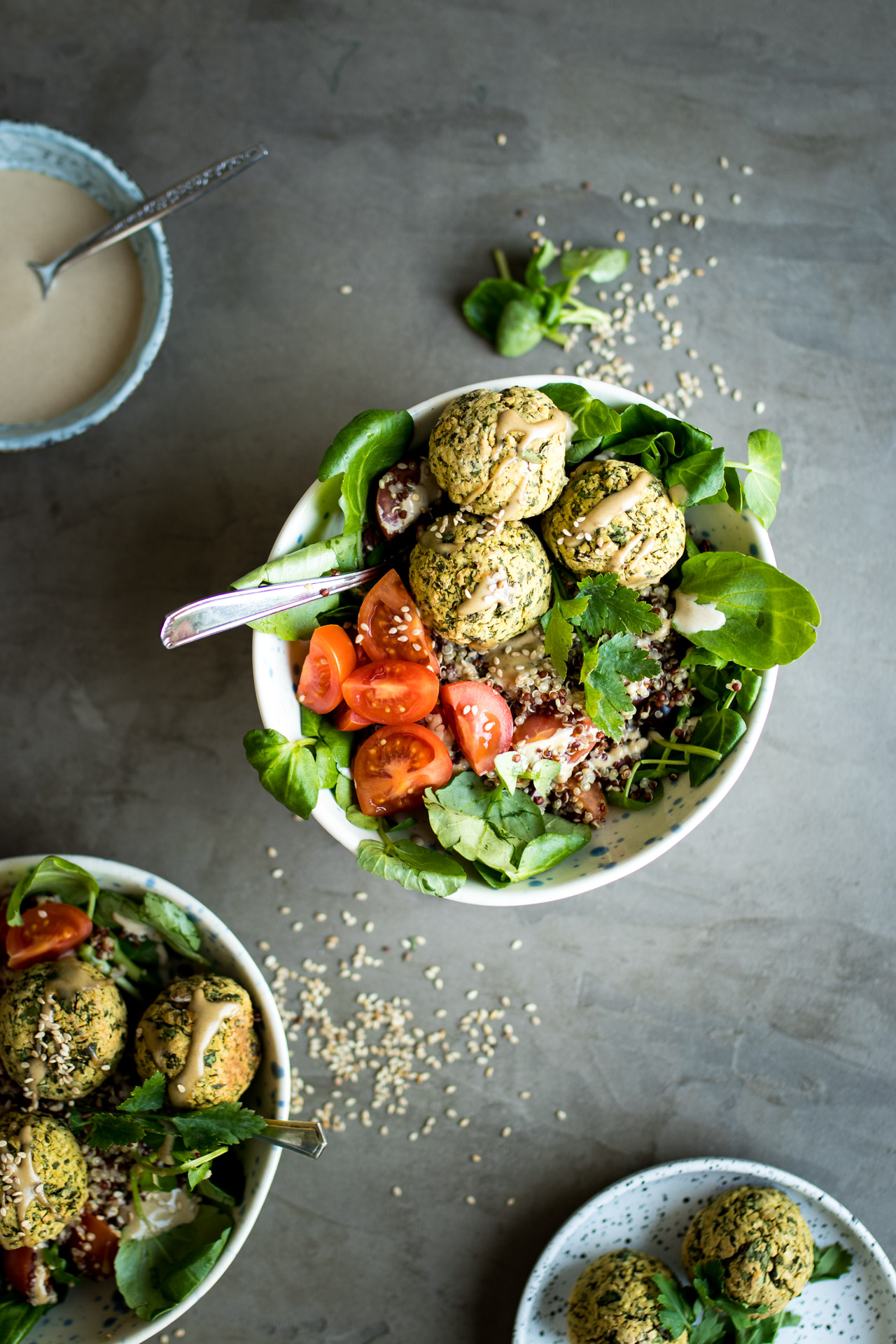 falafels and salad in a white bowl