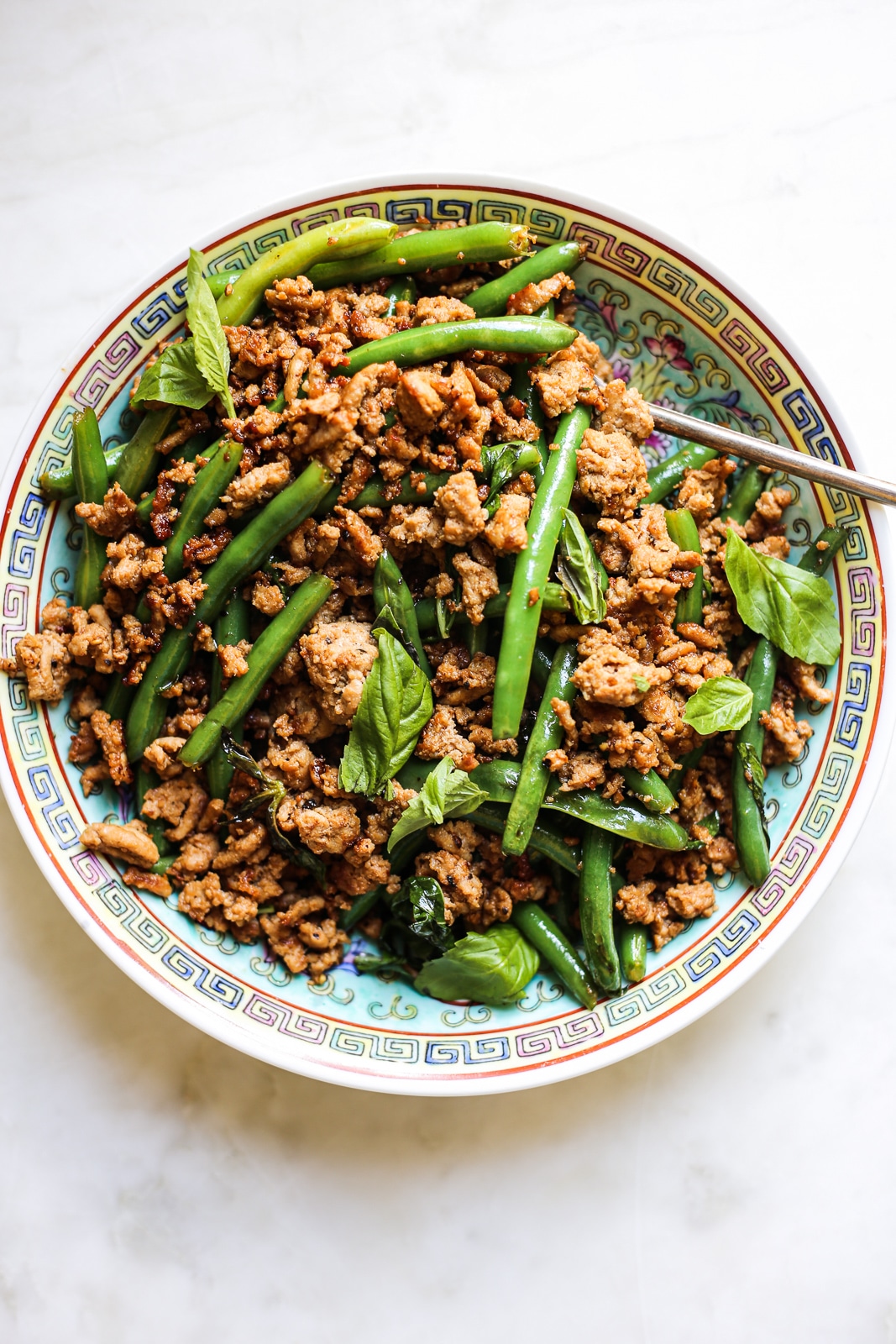 Green bean stir fry on a patterned plate