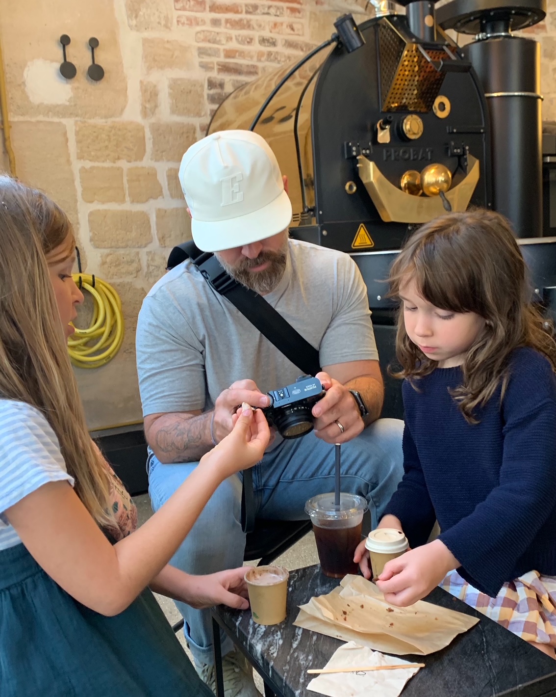 Dad and daughters at a coffee shop in Paris